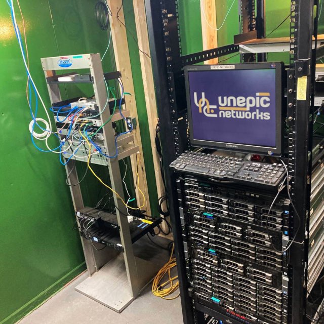 Rack-mounted servers and an Unepic Networks console in a network facility